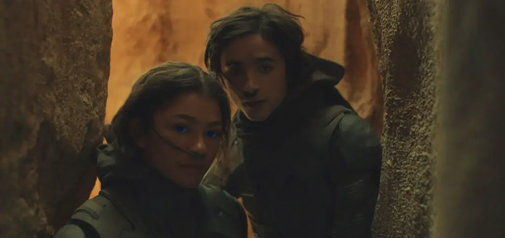 Chani (Zendaya) and Paul Atreides (Timothée Chalamet) underground, in the Dune movie. 
