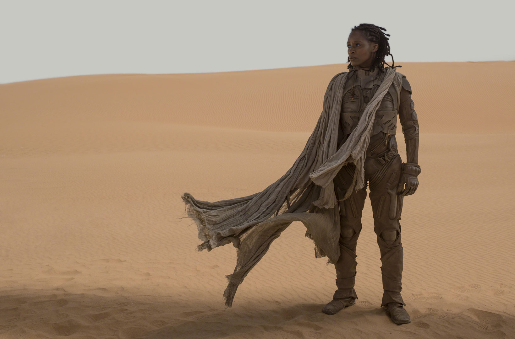 Liet Kynes in the desert. The planetologist is played by Sharon Duncan-Brewster in Dune (2021).