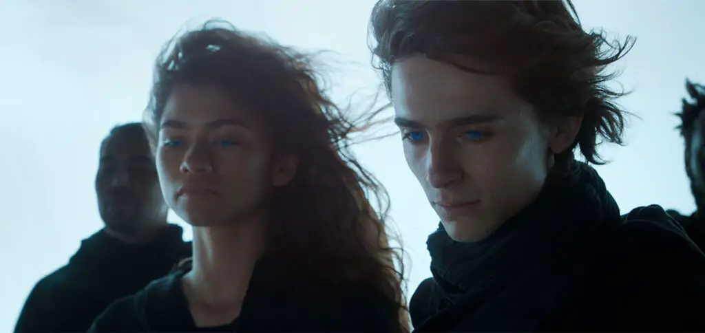 Zendaya as Chani and Timothée Chalamet in Dune (2021) movie.