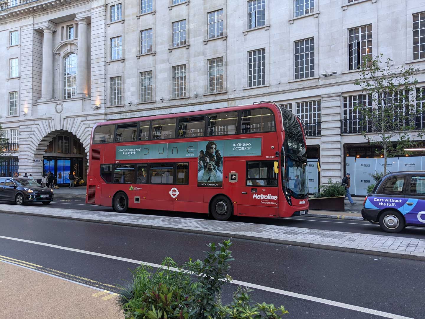 Dune movie advertisement on the side of an iconic red double-decker bus, driving down Regent Street in London.