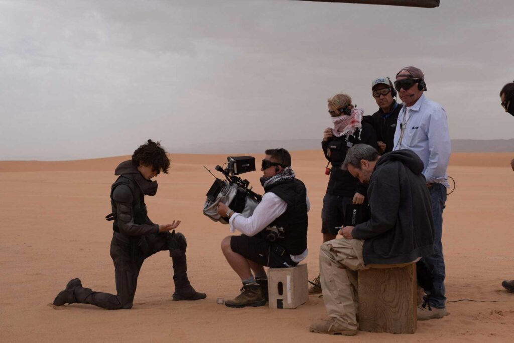 Dennis Villeneuve observes as Greig Fraser films a Timothée Chalamet close-up, for the spice harvester scene in 'Dune: Part One'.