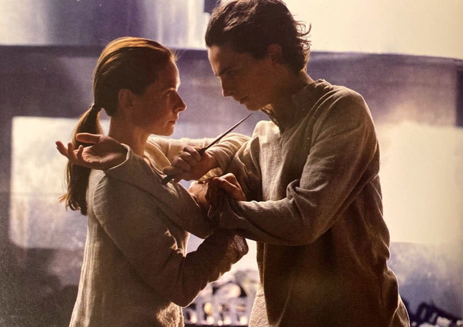 Photo of a deleted scene from 'Dune: Part One' movie: Lady Jessica (Rebecca Ferguson) trains Paul Atreides (Timothée Chalamet) in the arts of the Bene Gesserit’s knife fighting skills.