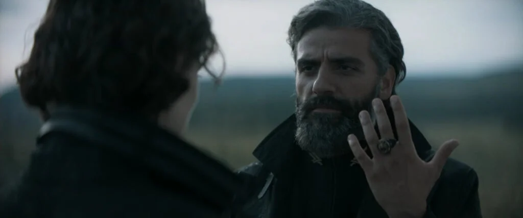 Duke Leto, played by Oscar Isaac, speaks to his son Paul in the 'Dune' movie.