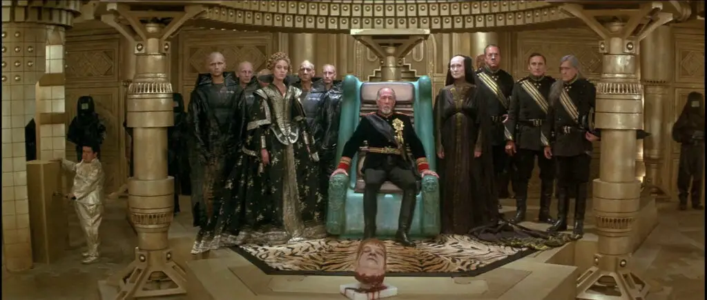 The Emperor sits behind the decapitated head of Rabban, in David Lynch's 'Dune' movie (1984).