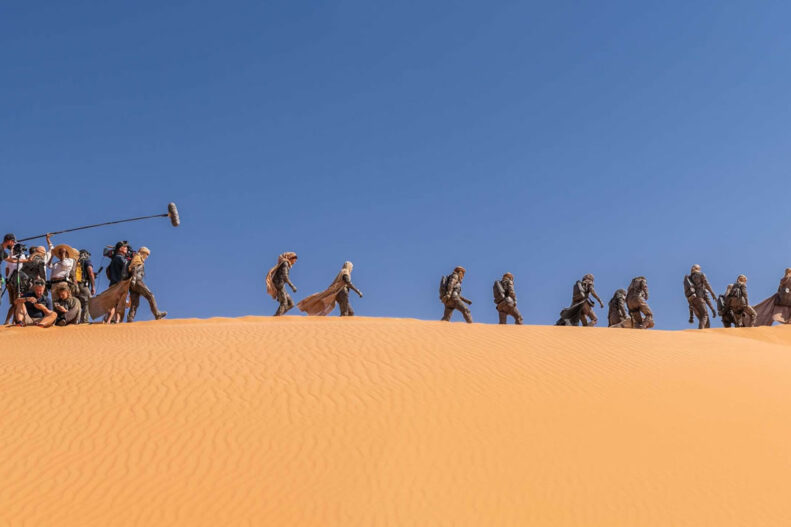 Preview from 'Dune Part Two: The Photography': Behind-the-scenes shot Fremen crossing the desert.
