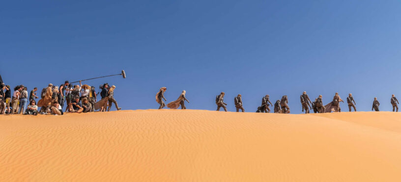 Preview from 'Dune Part Two: The Photography': Behind-the-scenes shot Fremen crossing the desert.