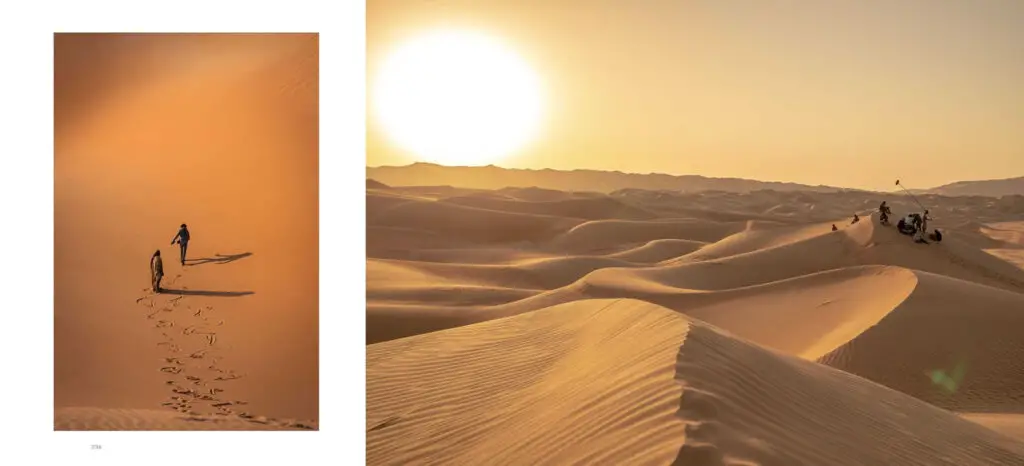 Photos from Insight Editions' 'Dune Part Two: The Photography': Chani and Paul walk across the sands as the sun sets.